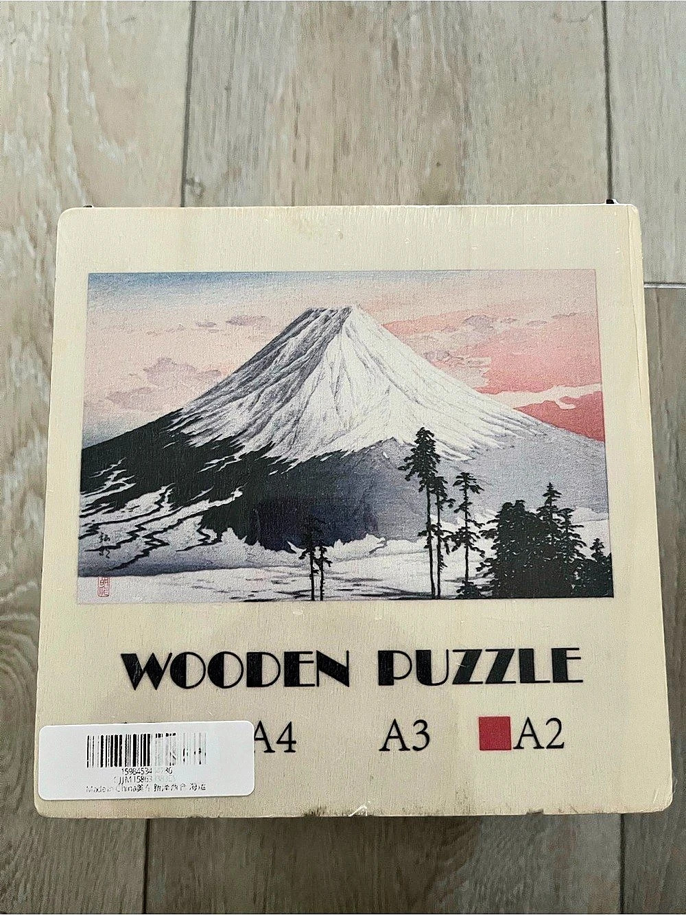 CraftHub Wooden Jigsaw Puzzle featuring Mount Fuji artwork.